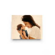 Tender moment between mother and baby on Cove Edge Wood Print for lasting memories
